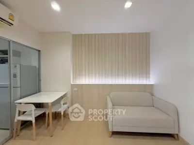 Modern minimalist living room with cozy sofa and dining area