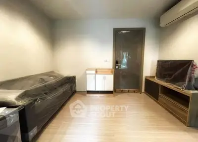 Modern living room with sleek furniture and air conditioning, perfect for cozy living.