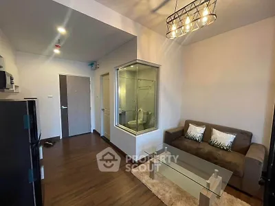 Modern living room with glass partition and stylish lighting