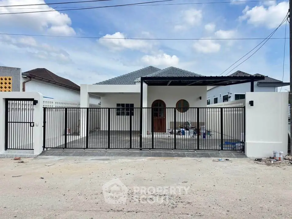 Charming single-story home with gated entrance and spacious driveway