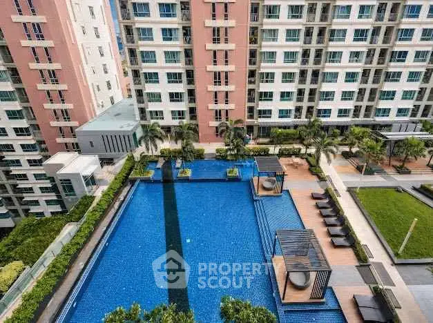 Luxurious condominium with stunning pool and lush landscaping, perfect for relaxation and leisure.