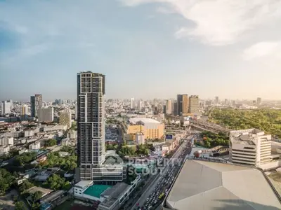 Stunning cityscape view showcasing modern high-rise buildings and lush greenery, perfect for urban living.