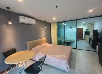 Modern studio apartment with open layout and stylish furnishings