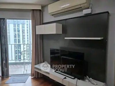 Modern living room with balcony view in high-rise apartment