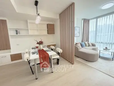 Modern open-plan living and dining area with stylish decor and natural light