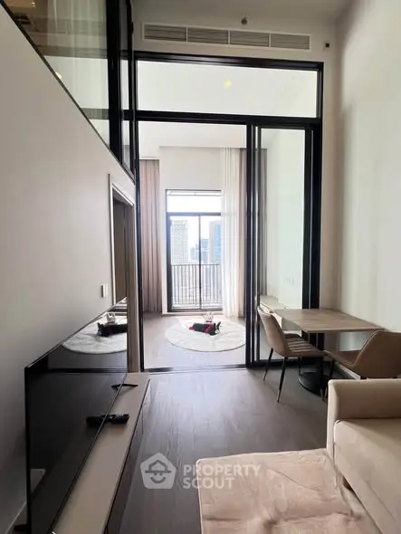 Modern living room with high ceiling and balcony view in luxury apartment