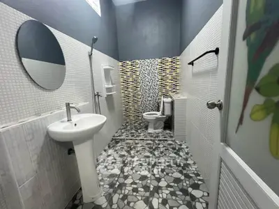 Modern bathroom with stylish tile design and sleek fixtures