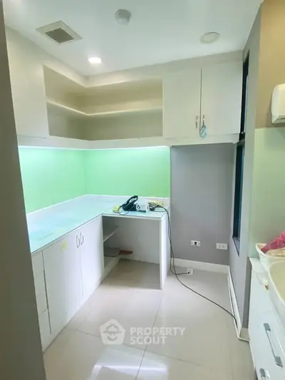 Modern kitchen with sleek cabinetry and bright lighting, perfect for culinary enthusiasts.