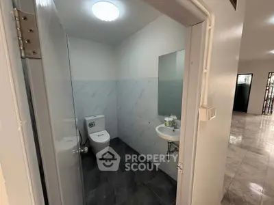 Modern bathroom with sleek design and compact layout