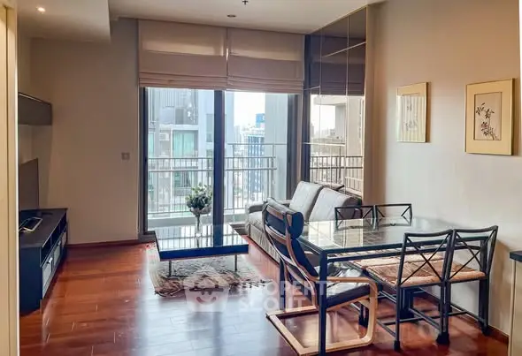 Modern living room with wooden flooring, large windows, and stylish furniture in a high-rise apartment.