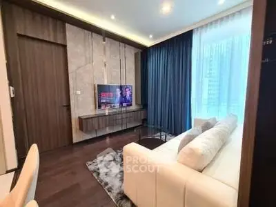 Luxurious modern living room with elegant decor and large window view.