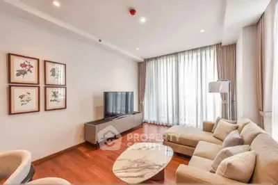 Spacious modern living room with elegant decor and large windows for natural light.