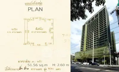 Modern high-rise building with detailed floor plan in urban setting.