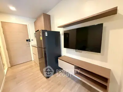 Modern apartment interior with sleek kitchen and stylish TV setup