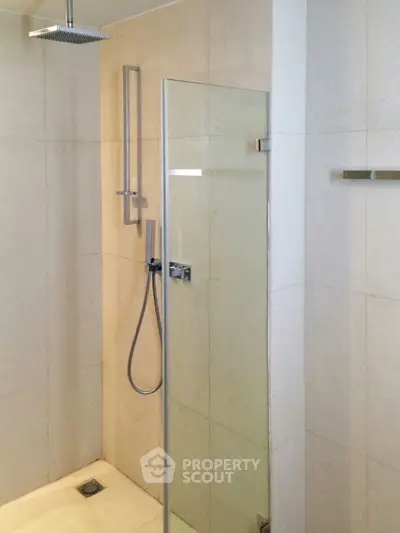 Modern bathroom with sleek shower design and glass partition