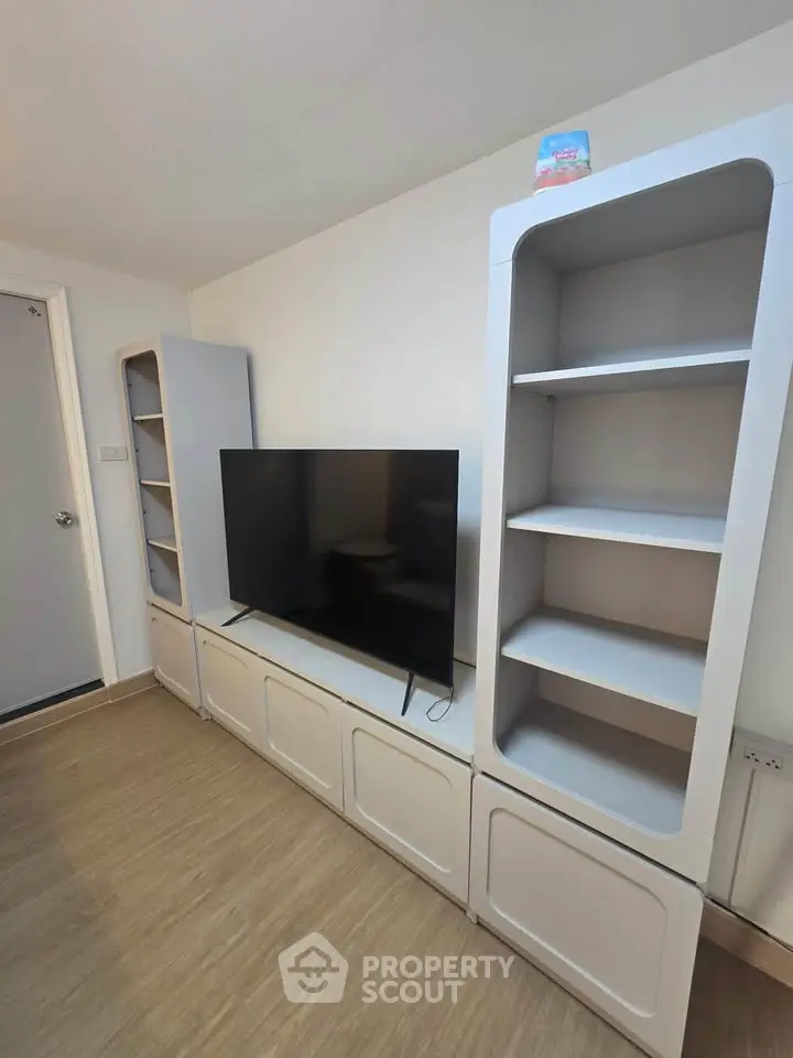 Modern living room with sleek TV unit and stylish shelving
