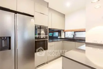 Modern kitchen with sleek appliances and open layout design