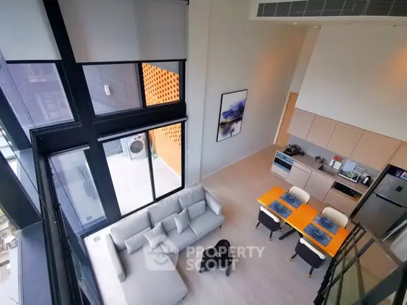 Modern loft apartment with high ceilings and open kitchen layout