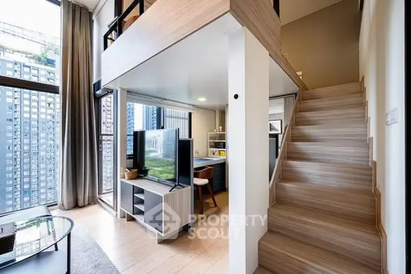 Modern loft apartment with mezzanine and large windows offering city views.