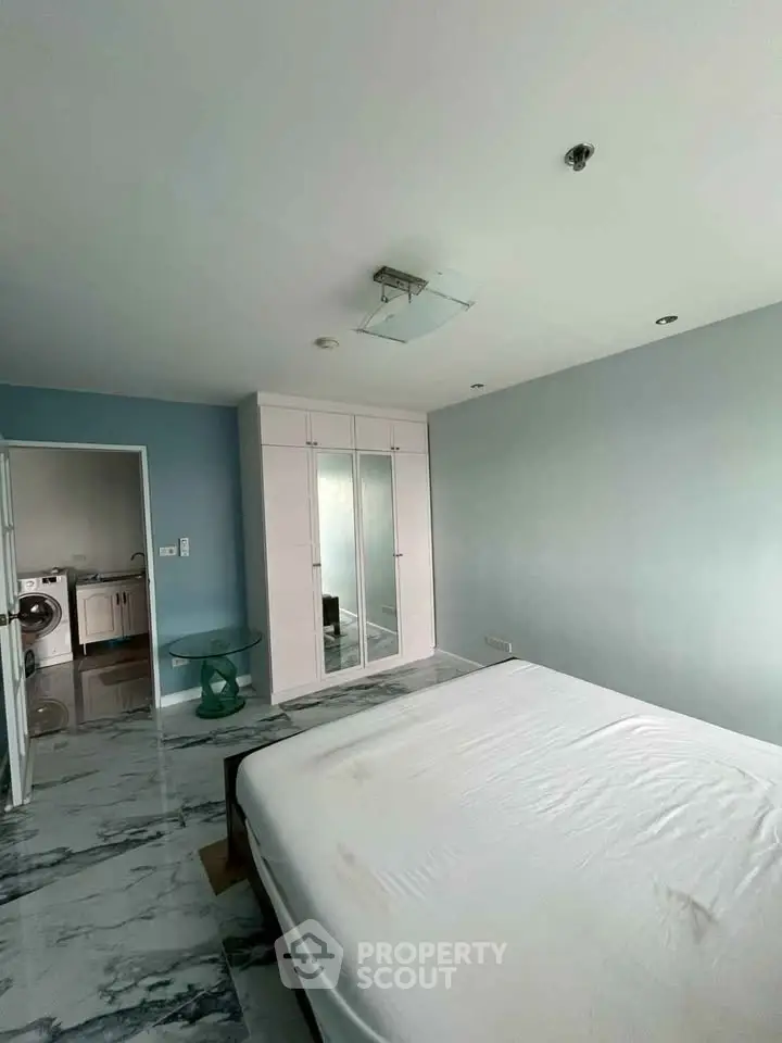 Spacious bedroom with modern design and marble flooring