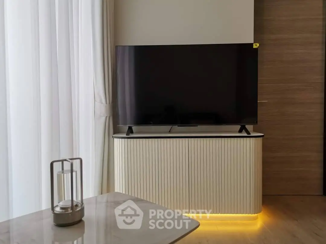 Modern living room with sleek TV stand and ambient lighting