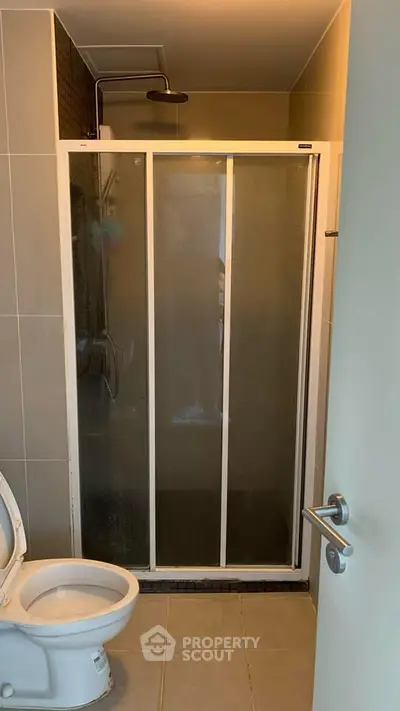 Modern bathroom with shower and toilet in sleek design