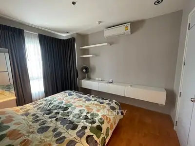 Cozy bedroom with modern decor and natural light