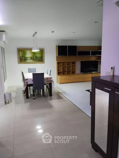 Spacious modern living room with elegant dining area and stylish furniture