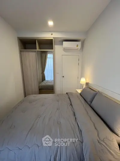 Cozy bedroom with modern design and ample natural light