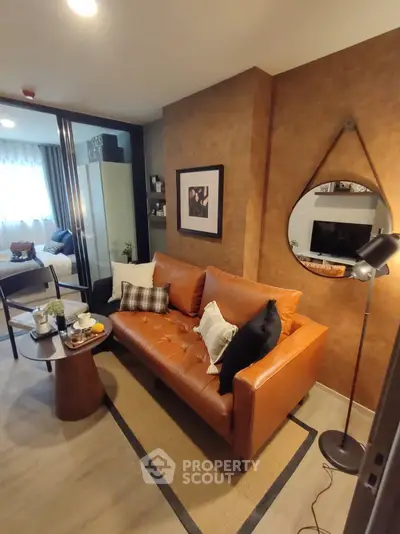 Stylish living room with leather sofa and modern decor in cozy apartment