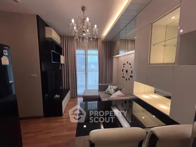 Luxurious living room with modern decor and chandelier lighting