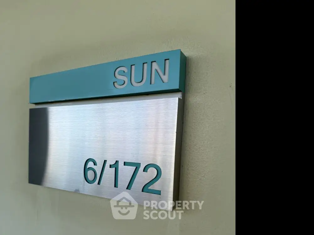 Modern apartment unit number sign with stylish design