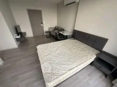 Modern bedroom with sleek furniture and air conditioning in a minimalist design.