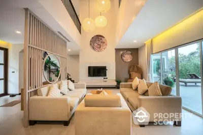 Luxurious modern living room with high ceilings and elegant decor, featuring large windows and stylish furniture.