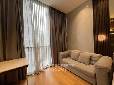 Modern living room with elegant curtains and cozy sofa in a stylish apartment.