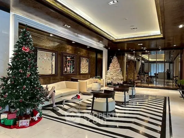 Luxurious lobby with festive Christmas decor and elegant seating area.