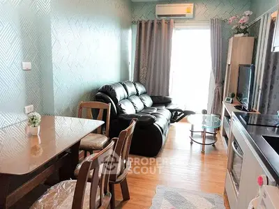 Charming living room with modern decor and natural light, featuring a cozy leather sofa and elegant dining area.