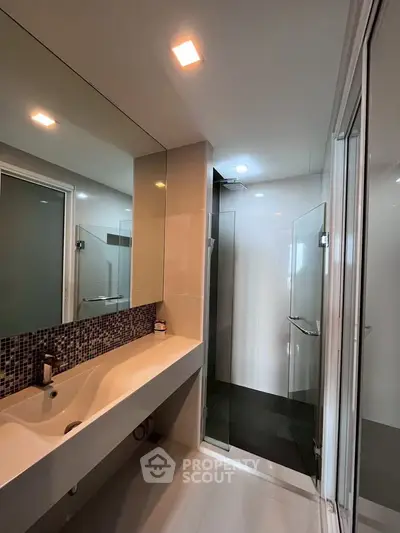 Modern bathroom with sleek design and glass shower enclosure