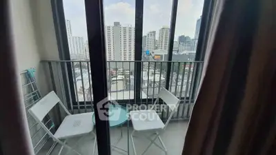 Charming balcony with city view, perfect for relaxation and enjoying urban skyline.
