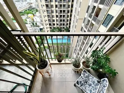 Charming balcony with lush plants and city view, perfect for relaxation.