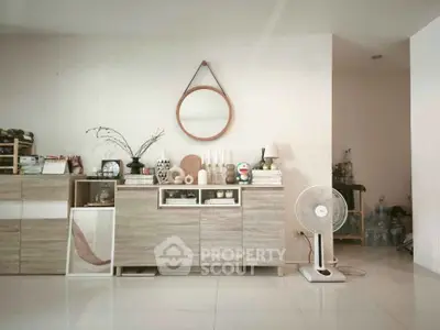 Stylish living room with modern decor and elegant storage solutions.