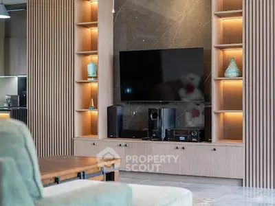 Modern living room with sleek entertainment center and ambient lighting