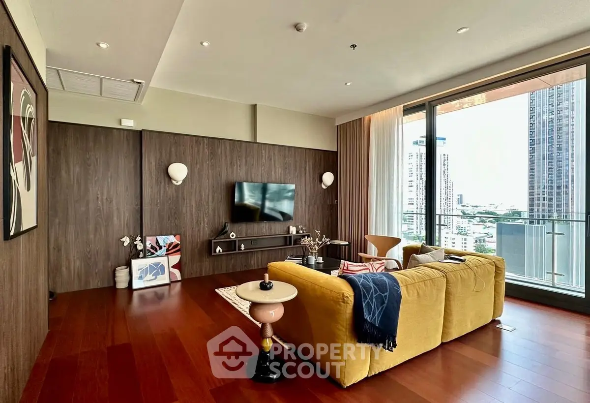 Luxurious living room with modern decor and stunning city view from large windows.
