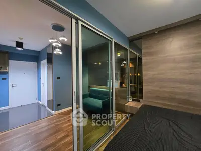 Modern apartment interior with glass partition and stylish lighting