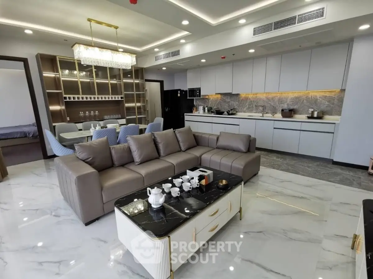 Luxurious open-plan living room with modern kitchen and elegant decor