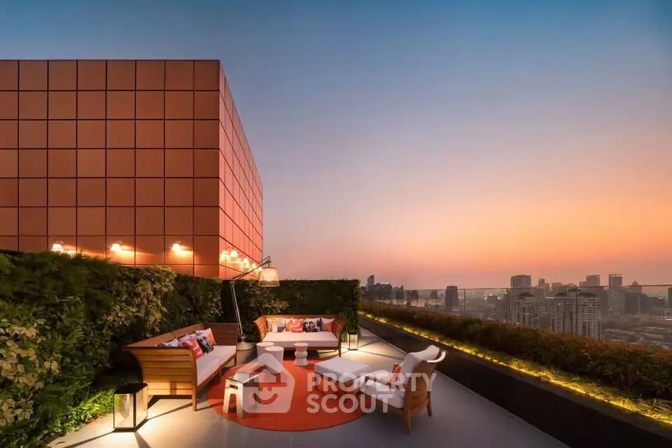 Stunning rooftop terrace with panoramic city views at sunset, featuring modern outdoor seating and lush greenery.