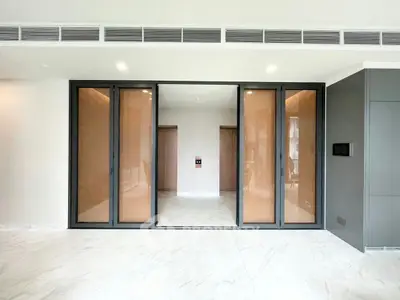 Spacious modern living room with sliding glass doors and marble flooring