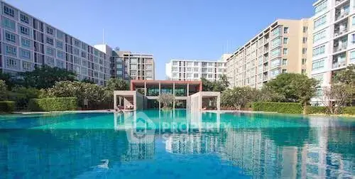 Luxurious residential complex with stunning pool and modern architecture.