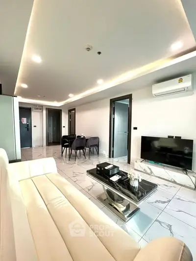 Modern living room with sleek design and elegant lighting