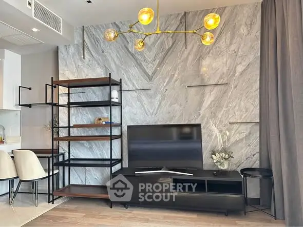 Modern living room with marble accent wall and stylish lighting